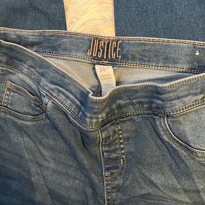 Girls plus size denim jeans, back left pocket stitches snagged.